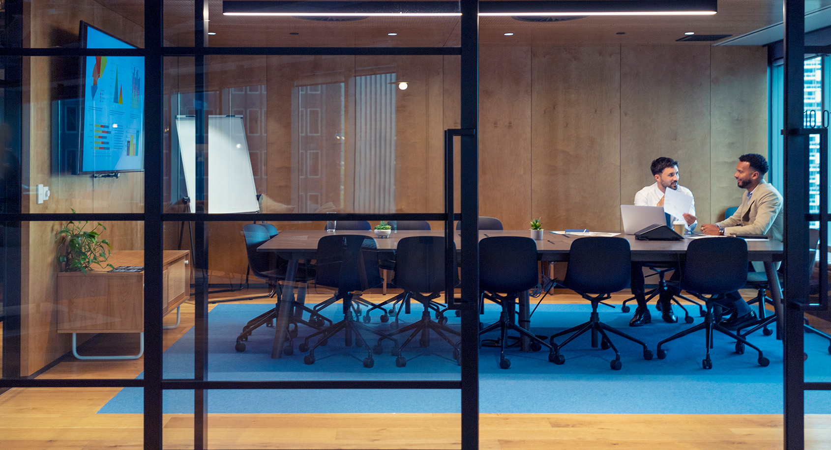 Two people in conference room
