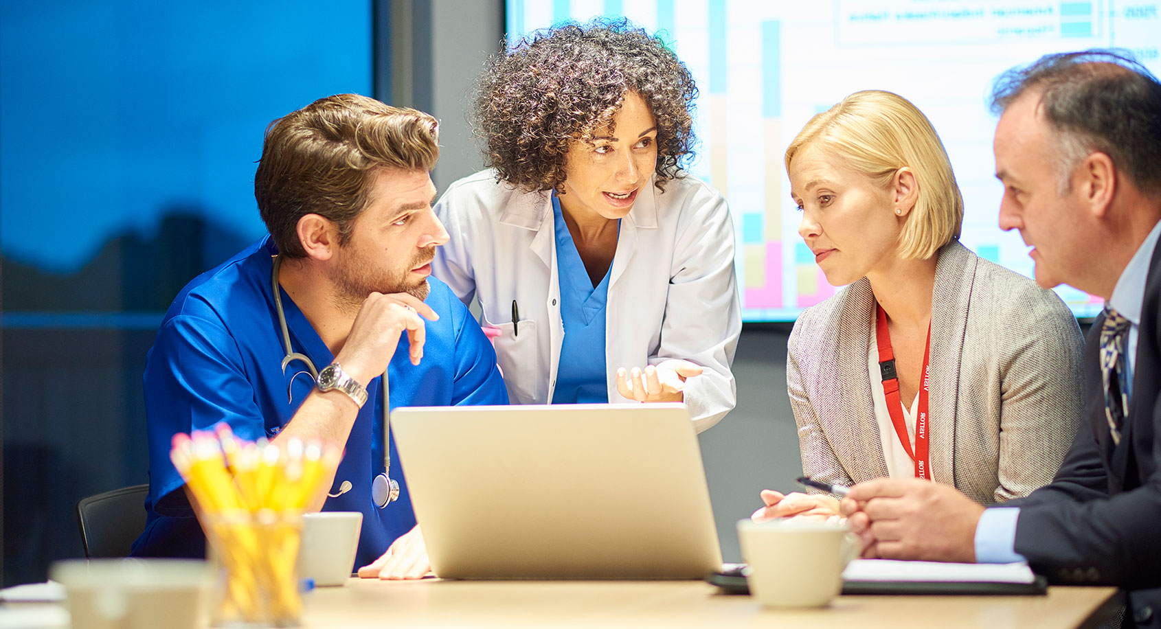 Doctors looking at a computer