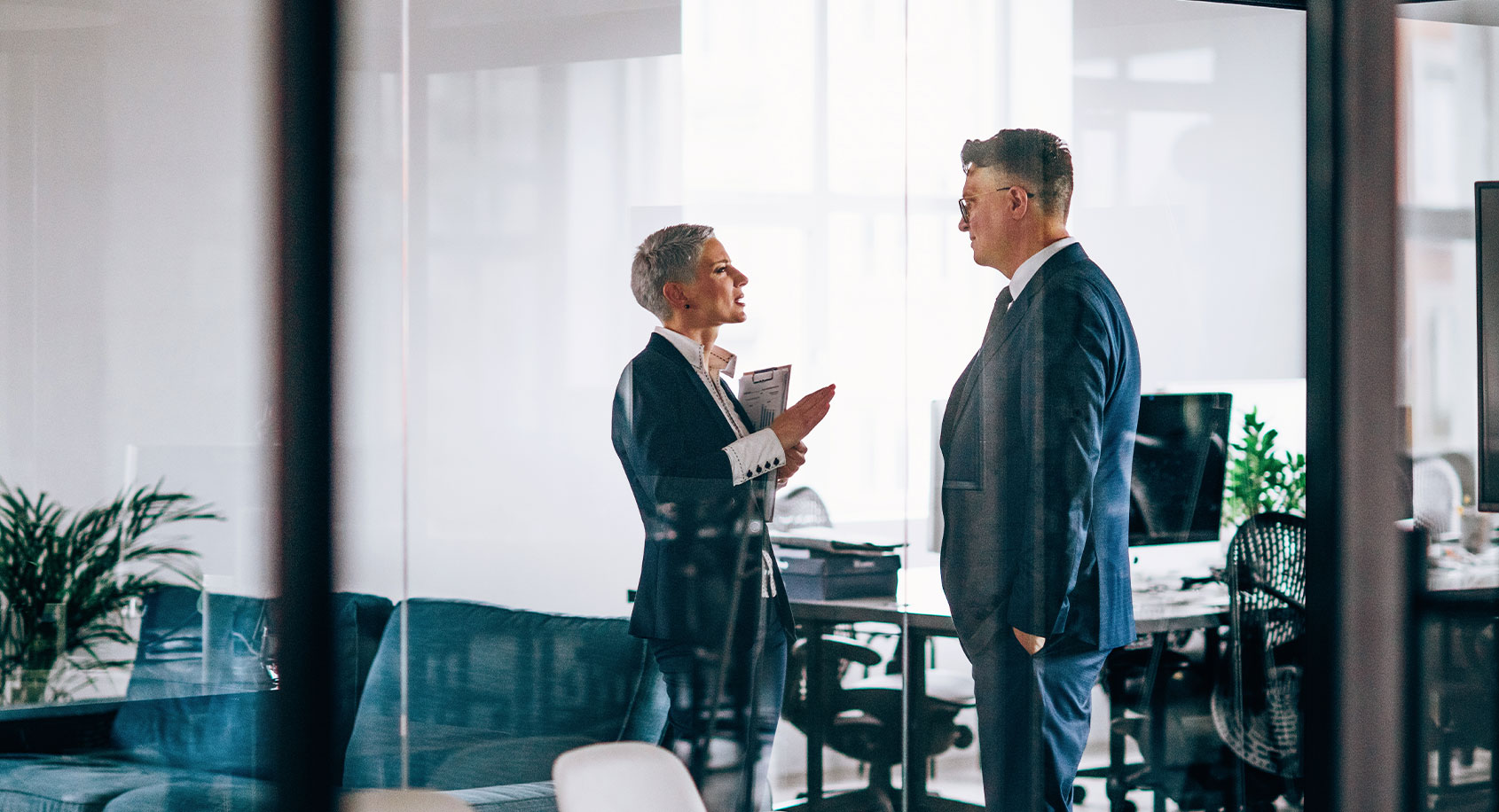 Man and woman in a conference room