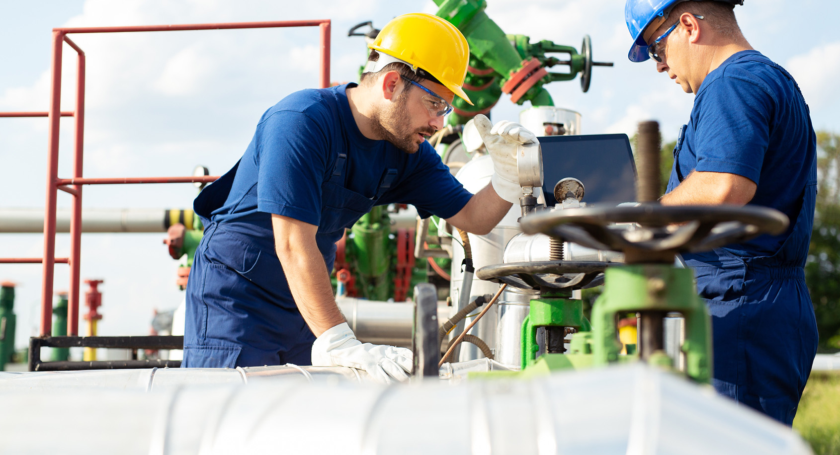 Men working on and oil pipeline