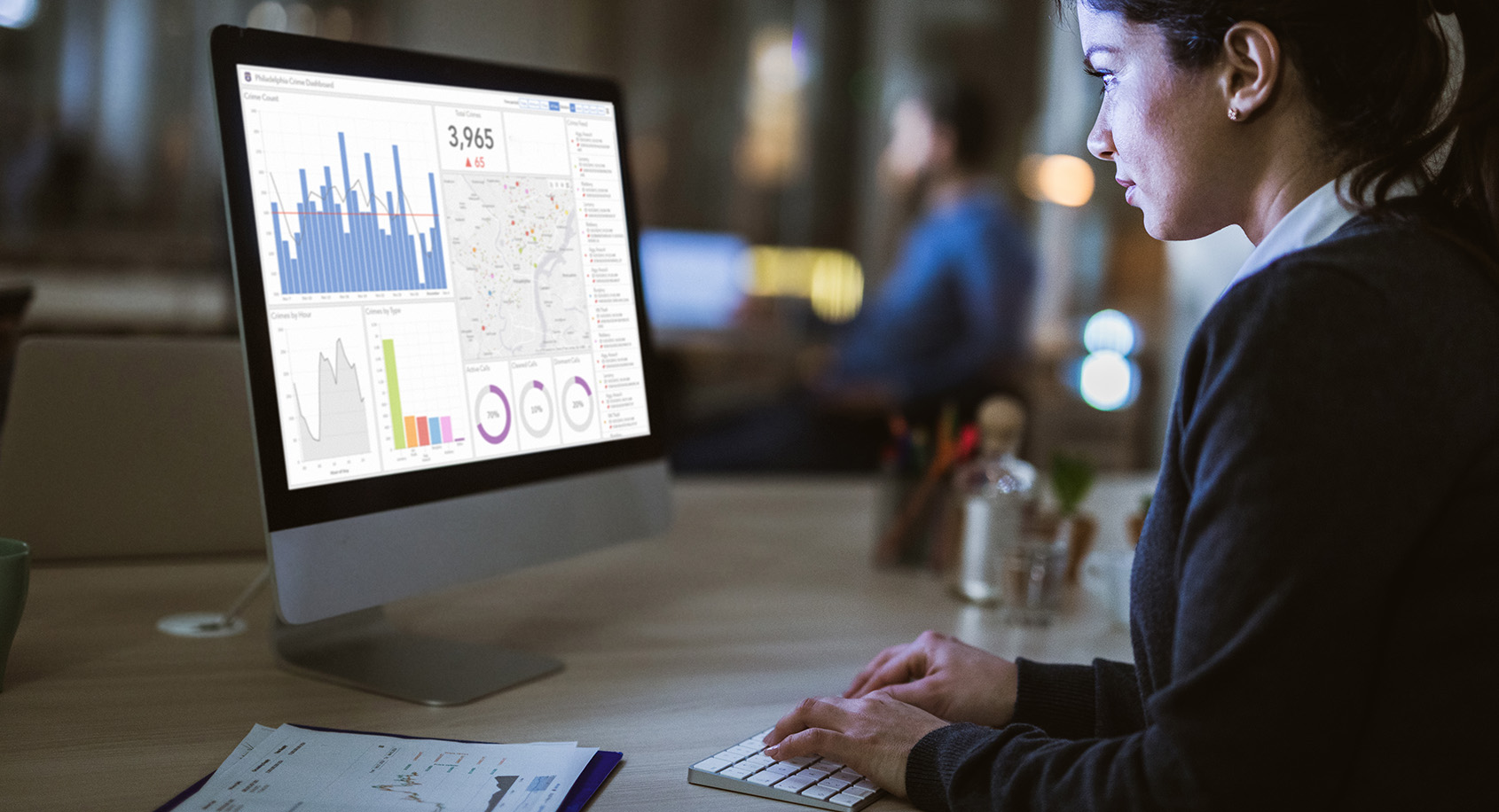 Woman looking at dashboards on computer screen